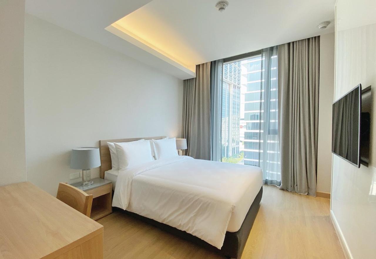 Oakwood Suites Banguecoque Exterior foto A bedroom at the hotel